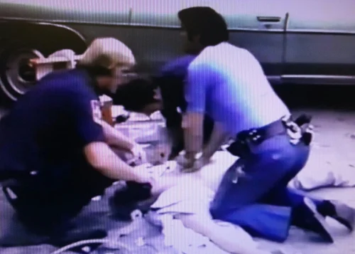 TV news captures police attempting to resuscitate Judge John Howland Wood Jr