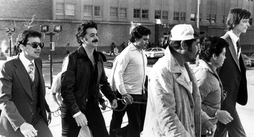 Joe Chagra and Jimmy Chagra walking to courthouse with other federal prisoners