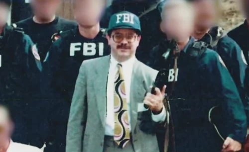 John Ruffo posing with the Assistant Director of the FBI's New York office, and members of their SWAT team